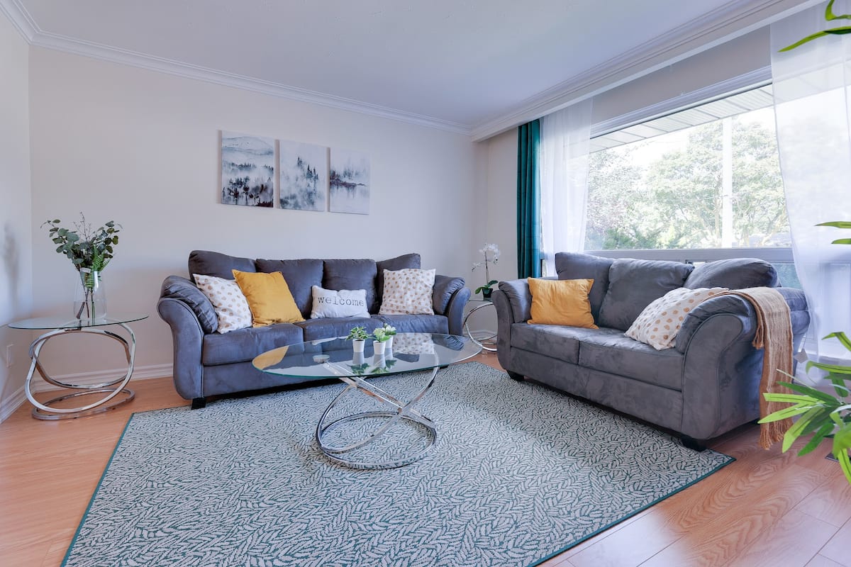 Grey sofas in the bright Adored Place living room